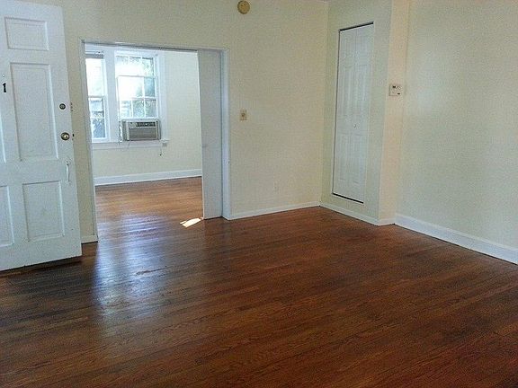 Living room, view into study, and of 1st floor closet door (converted stairway)