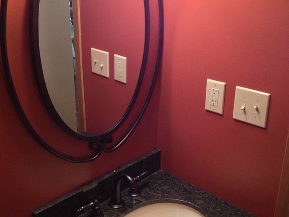 Powder room with granite and tile floor