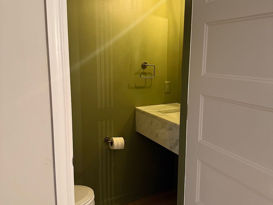 Main level powder room with marble floating vanity.