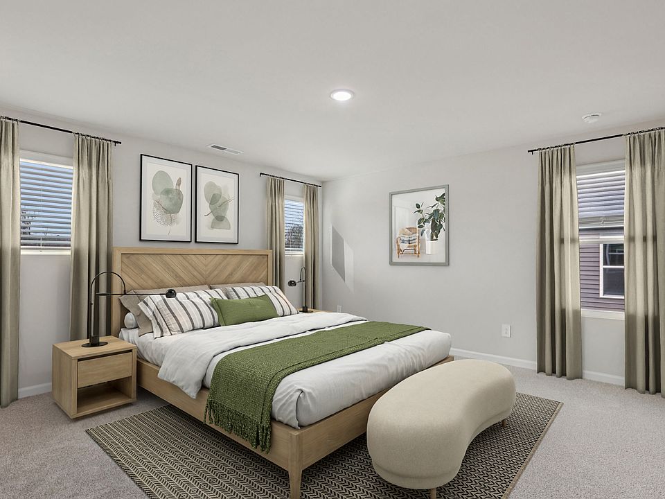 Primary bedroom in the Dallas floorplan at a Meritage Homes community in Garner, NC.