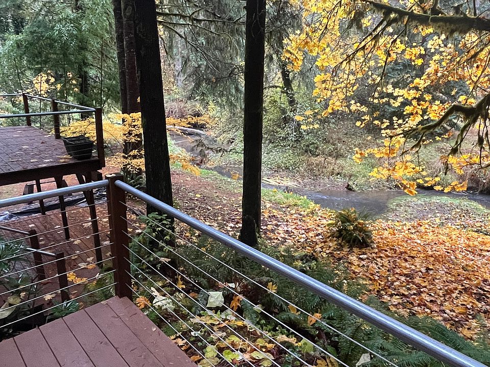 Every room overlooks beautiful stream. Three decks to enjoy tranquility. Kitchen, family room and daylight basement