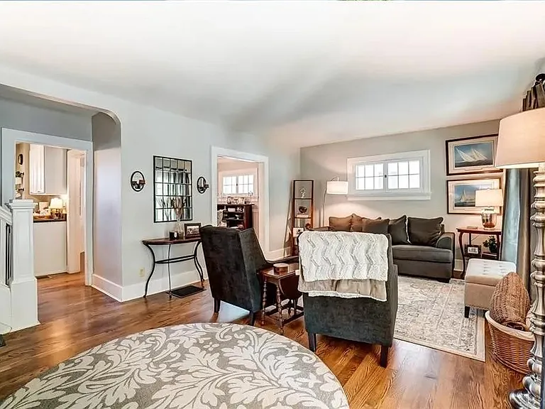 Living room to east with kitchen and dining room behind