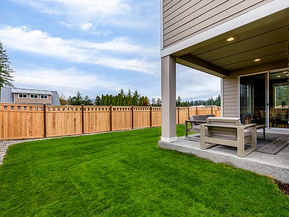 Fenced and landscaped backyard