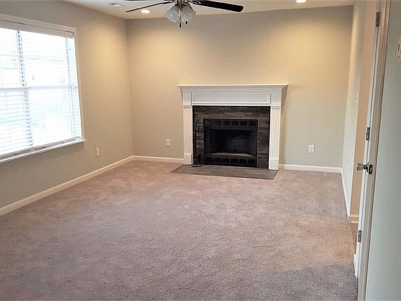 Living Area w/ Beautiful Fireplace Accents