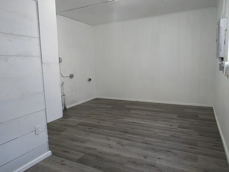 Very large laundry/utility room and back entry into the home