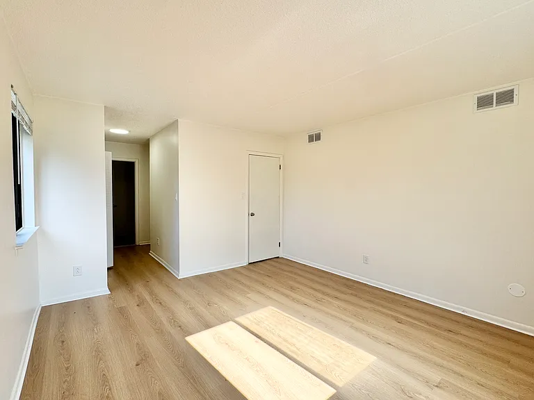 Spacious primary suite with ample natural light