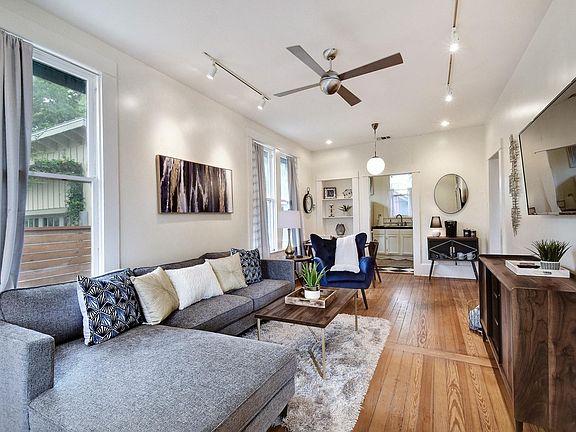 Enjoy this spacious living room with the 55" mounted Roku TV for your streaming enjoyment!