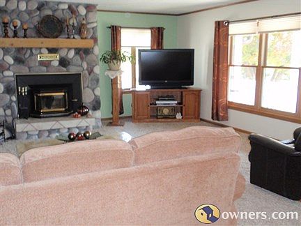 Living room with large windows and fireplace