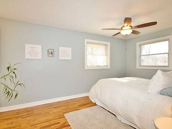 The master bedroom boasts clean lines and multiple windows for enjoying beautiful natural light be it sun or moon!