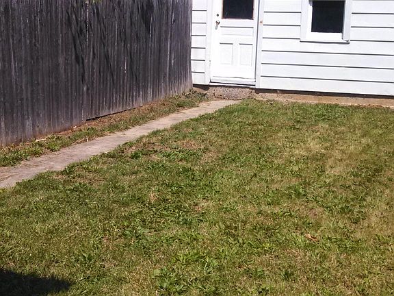 Fully Fenced Back yard and connected storage shed