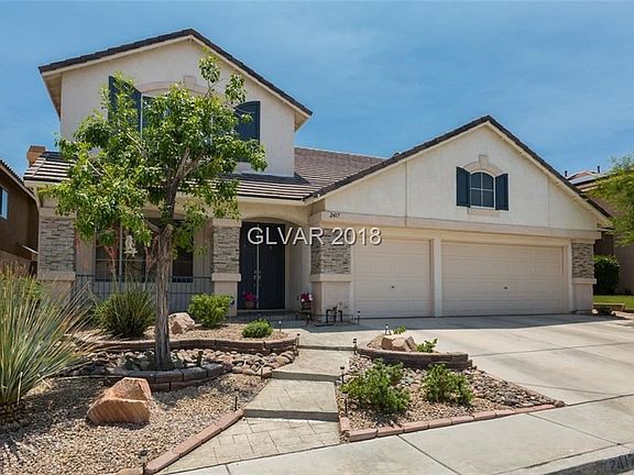 Front exterior with stamped concrete walk way.