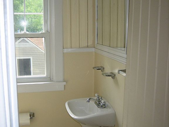 Upper bath - has marble-walled shower & pedestal sink