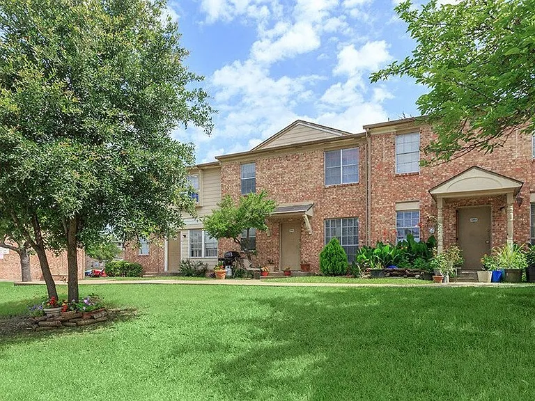 Inviting entrance path leading to your new home surrounded by mature shade trees.
