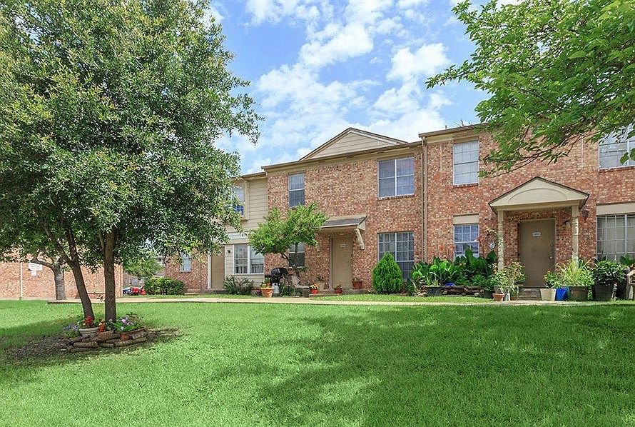 Inviting entrance path leading to your new home surrounded by mature shade trees.