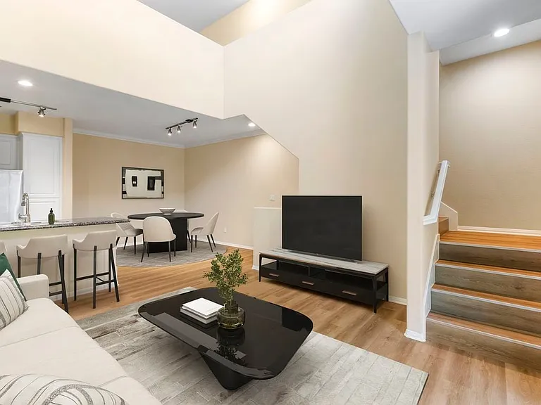 Renovated Package I living and dining room with hard surface flooring
