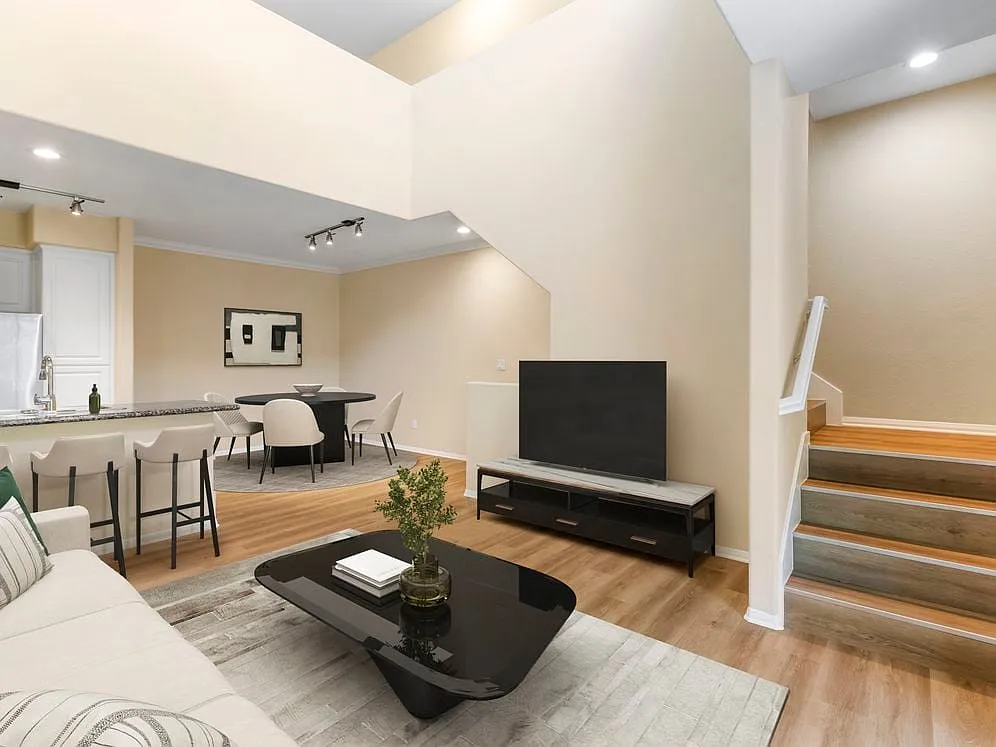 Renovated Package I living and dining room with hard surface flooring - Avalon Glendale