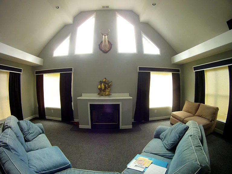 Living Room, Tray shelves on either side can accommodate surround sound speakers.
