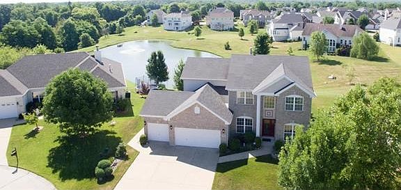 Tucked away in a quiet cul-de-sac, this home has a beautiful water view that has a resort feel!