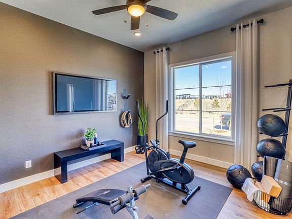 Secondary bedroom shown as a functional, at home gym.