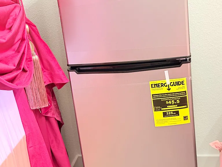 Kitchen includes a full-size refrigerator/freezer for convenient food storage and meal prep.