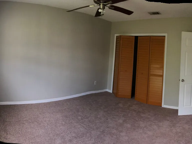 Master bedroom with new carpet and new closet doors