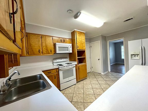 Kitchen includes a refrigerator