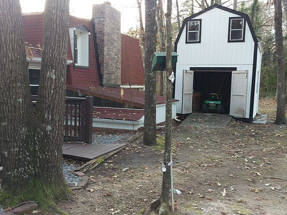 Rear with 2 story shed.