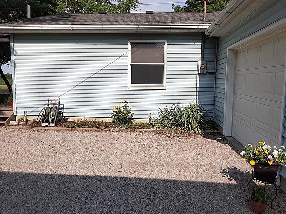 East side against driveway