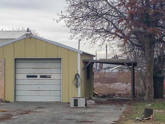 Detached garage-shop with carport
