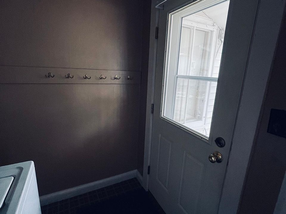 Rear entry/ mud room/ washer room. As seen from the kitchen. This is accessed from the deck.