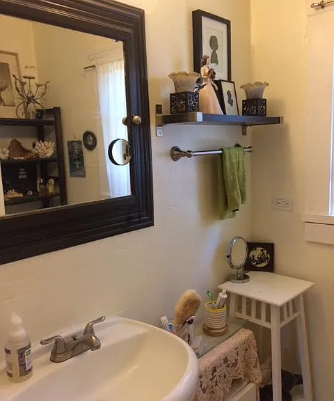 Bathroom. Has shower and bathtub an cabinet room for towels and toiletries.