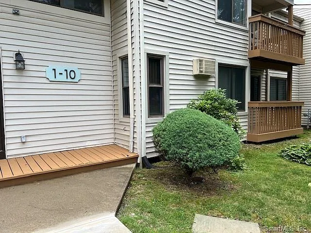FRONT OF BUILDING- 1ST FLOOR UNIT WITH OUTDOOR PRIVATE DECK