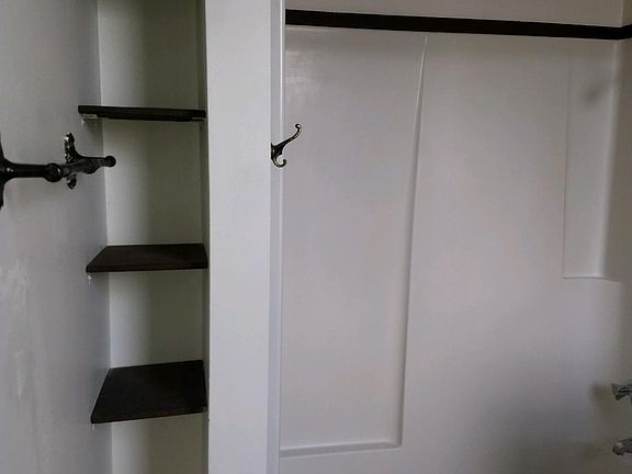 SMALL BIULT IN SHELVES IN THE BATHROOM