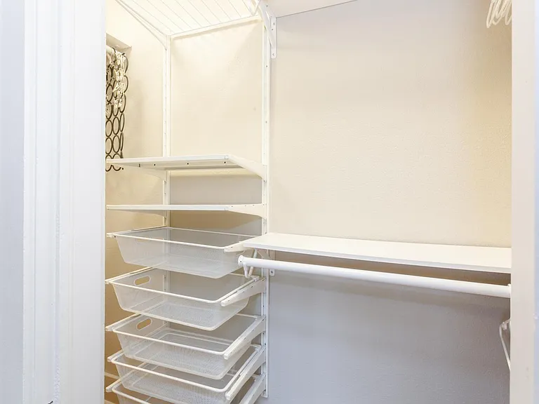 Large closet with lots of storage in primary bedroom