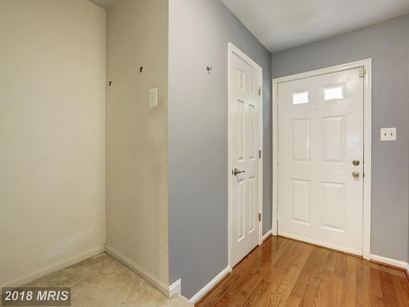 Front Door Interior -Door on the Left is 1/2 bath