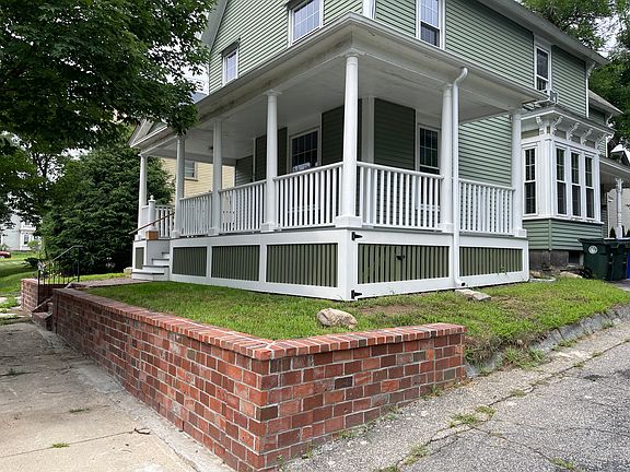 Newly installed brick retaining wall and rehabbed porch.