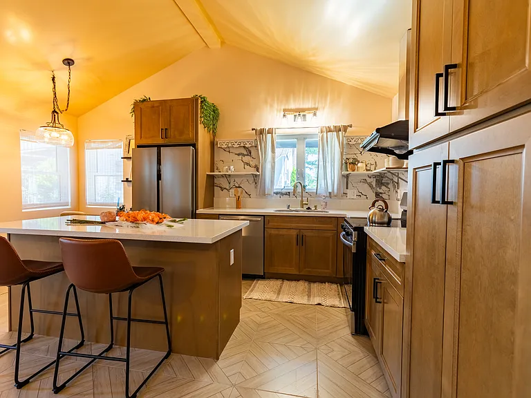 Sedona-Inspired Kitchen
Large kitchen island for food prep and dining with plenty of storage space in cabinets and shelves.