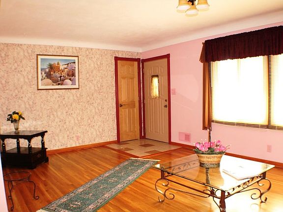 The living room has beautiful hardwood floors.