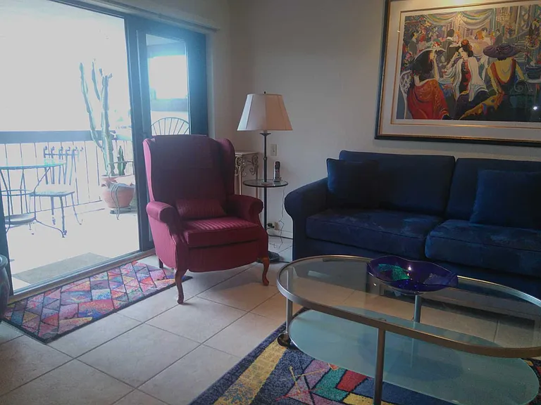 LIVING ROOM OPENS ONTO A PLEASANT BALCONY AREA
