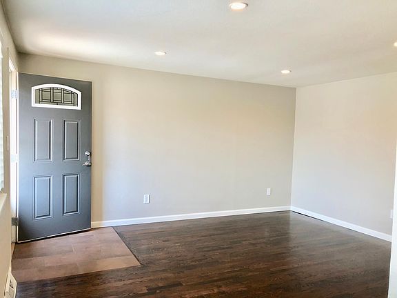 Spacious, light-filled living room w/ tile entry