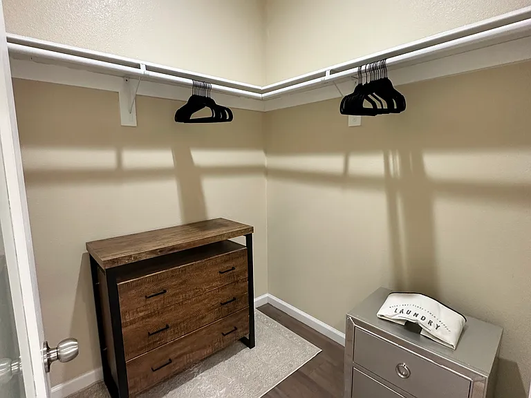 Walk-in closet in upstairs suite with private entrance