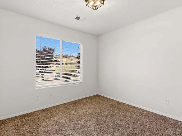 Third bedroom overlooks front yard and can be used as an office as well.
