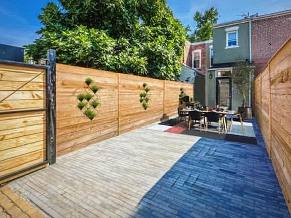 Fabulous rear yard has room for entertaining and parking a car!