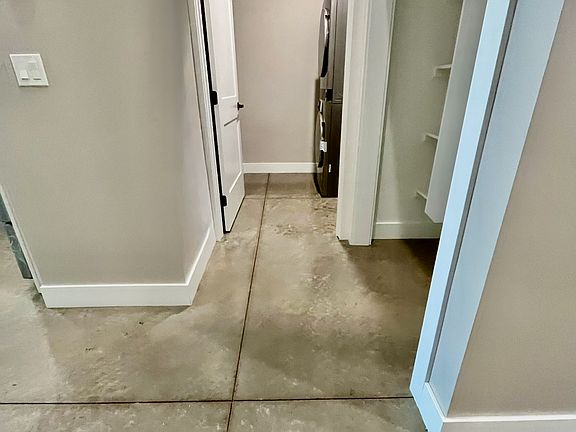 Laundry room with washer and dryer included. Wash sink as well.