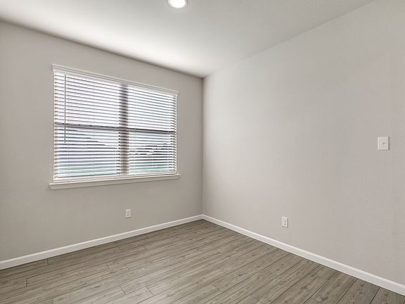 Dining room in the Sapphire home plan by Trophy Signature Homes - REPRESENTATIVE PHOTO