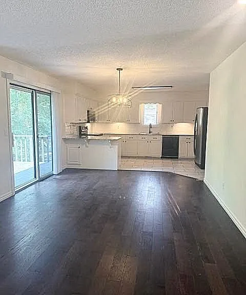 Spacius dinning area that leads to the back deck