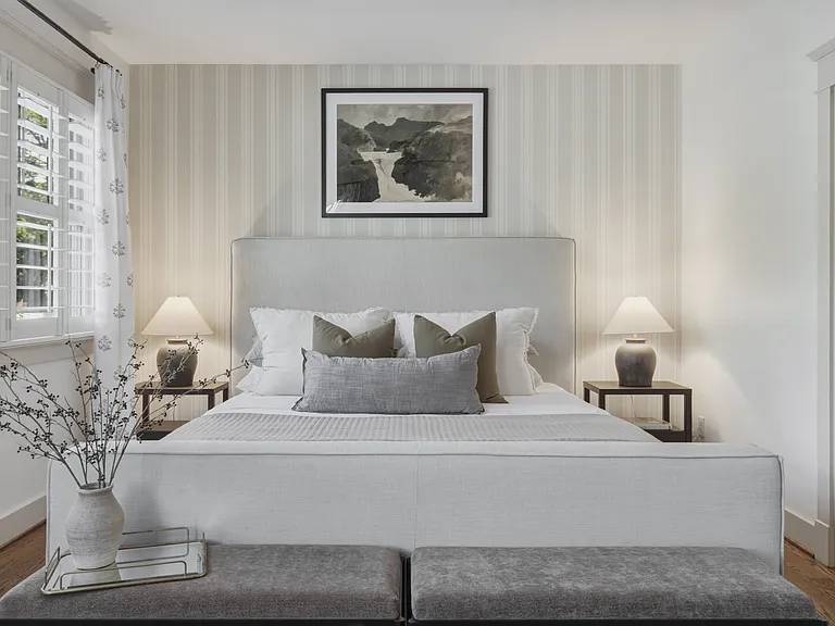 The primary suite features a king-sized bed, huge walk-in closet, ceiling fan, dresser, smart TV, and ensuite bathroom.