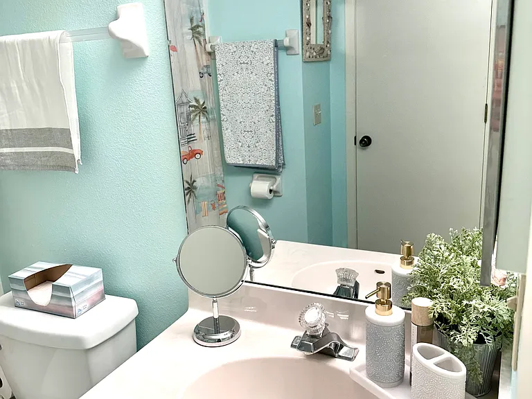 __ Featuring a full bathtub and shower combo, our guest bathroom is equipped for every preference. It's conveniently located and beautifully maintained, ensuring your guests feel right at home from the moment they arrive.