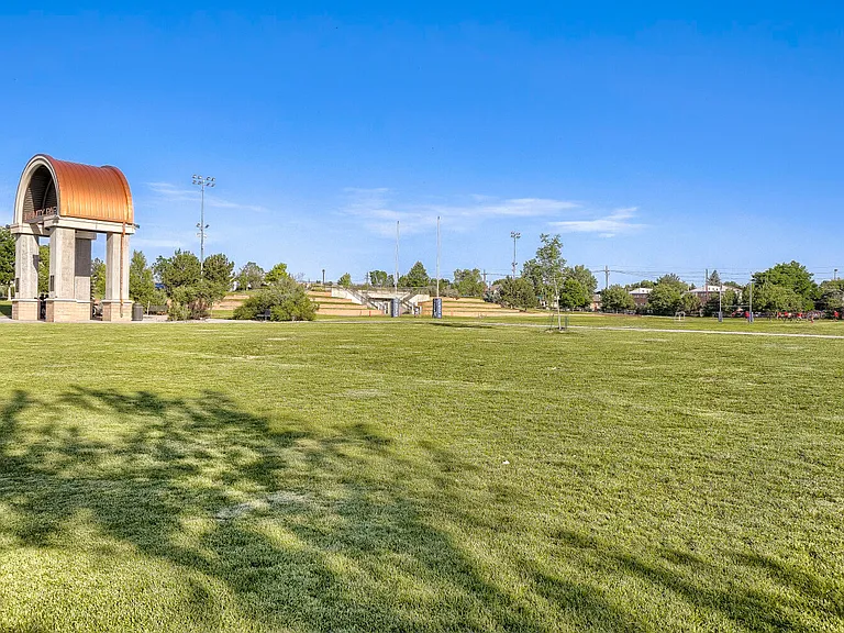 Infinity Park Greenspace - Expansive green space providing a scenic backdrop for walking, relaxing, and outdoor activities.