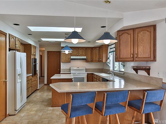 Large kitchen with plenty of counter space, storage and kitchen island.  Two ovens!  Three bar stools come with the house.